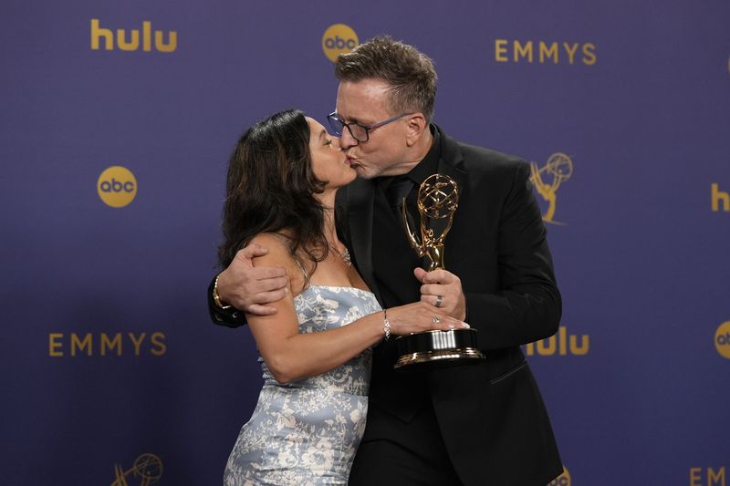 Ludmila Cliett, left, and Michael Cliett, winner of the award for outstanding special visual effects in a season or a movie for "Shogun", pose in the press room during the 76th Primetime Emmy Awards on Sunday, Sept. 15, 2024, at the Peacock Theater in Los Angeles. (AP Photo/Jae C. Hong)