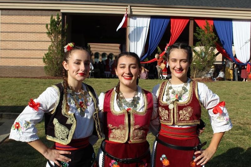 Three young women proudly wear their native costumes at Serb Fest, coming Sept. 28-29 in Lilburn. (Courtesy of Serb Fest/Kristina Mijatovic)