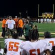 Stockbridge coach Kendrick Callier (center) talks to his players after their 14-10 win over Ola, Oct. 4, 2024