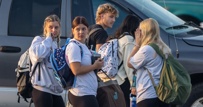 As students arrived at Apalachee High School on Tuesday morning, Sept.24, 2024 the scene looked like a typical school day. Cars and buses circled through the car pool drop-off. Students carrying backpacks made their way from the parking lot to class. Tuesday was the first day of classes at the Barrow County school since the shooting. (John Spink/AJC)