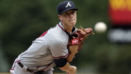 Braves starting pitcher Matt Wisler throws against the Colorado Rockies in the first inning of a baseball game in Denver, Saturday, July 11, 2015. (AP Photo/Joe Mahoney)
