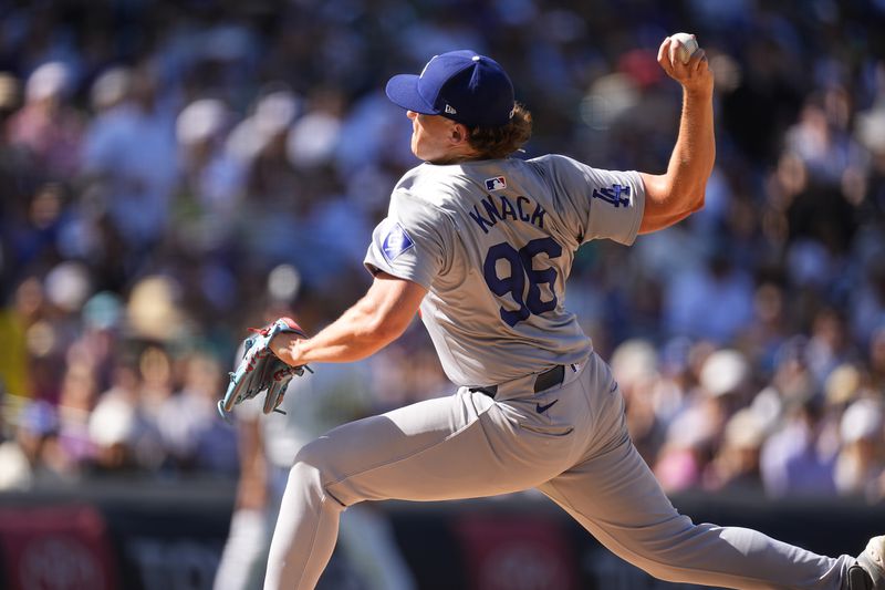 Los Angeles Dodgers relief pitcher Landon Knack works against the Colorado Rockies in the third inning of a baseball game Sunday, Sept. 29, 2024, in Denver. (AP Photo/David Zalubowski)