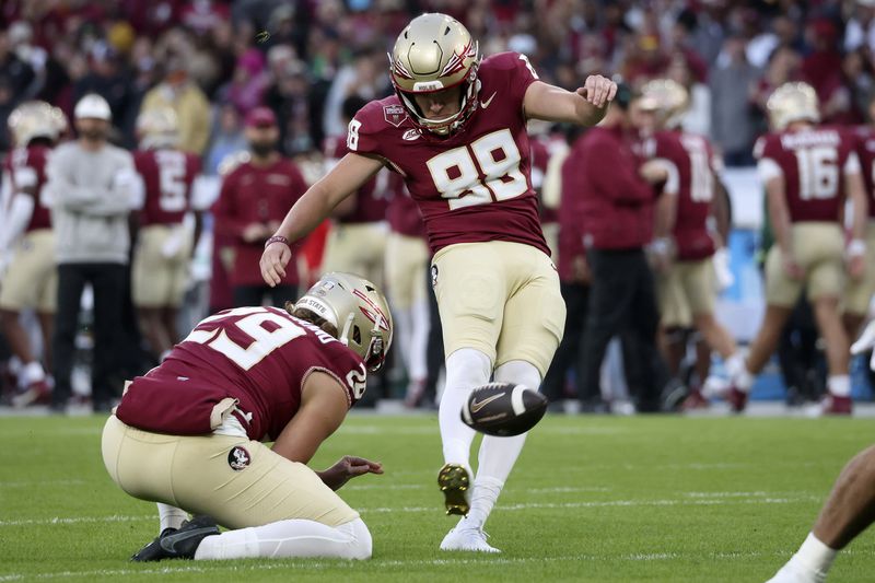 Florida's Ryan Fitzgerald kicks the ball during the NCAA college football game between Georgia Tech and Florida State at the Aviva stadium in Dublin, Saturday, Aug. 24, 2024. (AP Photo/Peter Morrison)