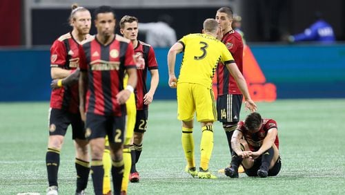 A Columbus Crew player tries to console Atlanta United's   Julian Gressel after the game.