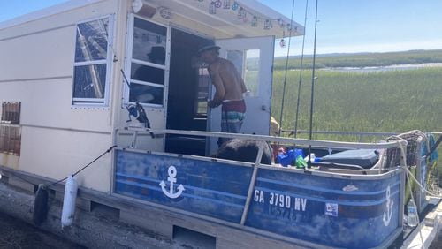 A boater who identifies himself only by the name Huck was washed ashore near Tybee Island during Hurricane Helene. (Adam Van Brimmer/AJC)