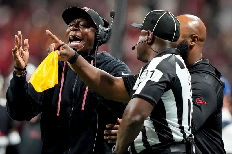 Atlanta Falcons head coach Raheem Morris speaks with field judge Mearl Robinson (31) during the first half of an NFL football game against the Kansas City Chiefs, Sunday, Sept. 22, 2024, in Atlanta. (AP Photo/Brynn Anderson)