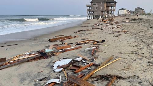 This photo provided by the National Park Service on Friday, Aug. 16, 2024, in Rodanthe, N.C., along the Cape Hatteras National Seashore shows debris from an unoccupied beach house that collapsed into the Atlantic Ocean from winds and waves caused by Hurricane Ernesto. (Cape Hatteras National Seashore via AP)