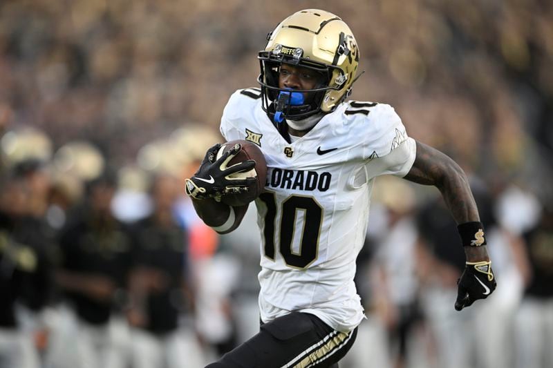 Colorado wide receiver LaJohntay Wester (10) scores a 10-yard touchdown on a pass play during the second half of an NCAA college football game against Central Florida, Saturday, Sept. 28, 2024, in Orlando, Fla. (AP Photo/Phelan M. Ebenhack)