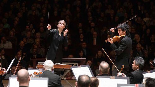 Guest conductor Karina Canellakis leads violinist Itamar Zorman and the ASO in Berg’s violin concerto. PHOTO: Jeff Roffman