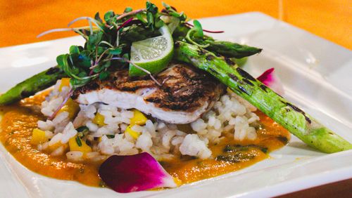 The menu at Wahoo Grill includes mahi mahi and Chateau Ducasse sauvignon blanc. (Courtesy of Wahoo Grill)