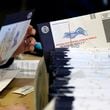 FILE - Chester County, Pa., election workers process mail-in and absentee ballots, in West Chester, Pa., Nov. 4, 2020. (AP Photo/Matt Slocum, File)