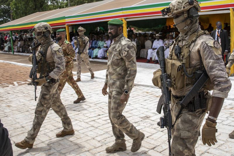 FILE - Leader of Mali's ruling junta Lt. Col. Assimi Goita, center, attends an independence day military parade in Bamako, Mali on Sept. 22, 2022. (AP Photo, File)