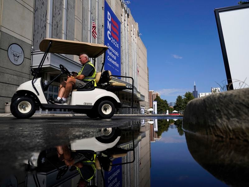 Workers prepare for the Democratic National Convention at United Center, Saturday, Aug. 17, 2024, in Chicago. (AP Photo/Kiichiro Sato)