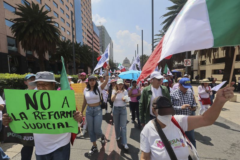 Federal court workers gather as they strike over reforms that would make all judges stand for election in Mexico City, Sunday, Aug. 25, 2024. (AP Photo/Ginnette Riquelme)