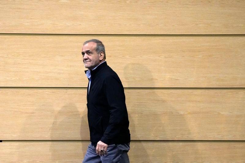 Iranian President Masoud Pezeshkian walks towards the podium at his press conference in Tehran, Iran, Monday, Sept. 16, 2024. (AP Photo/Vahid Salemi)