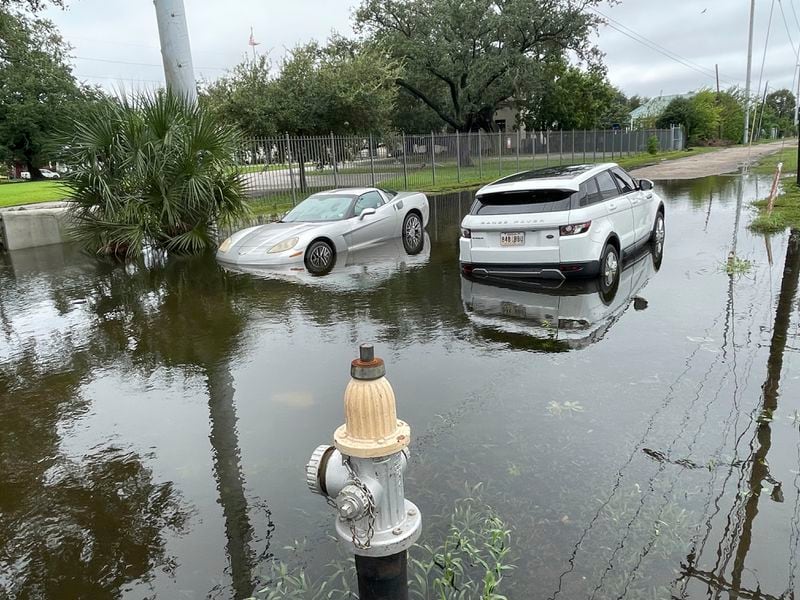 Stalled cars sit at a flooded intersection in New Orleans on Thursday, Sept. 12,, 2024, the morning after Hurricane Francine hit the city. (AP Photo/Kevin McGill)