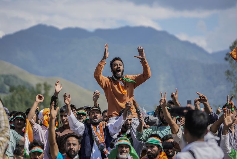 Supporters of India's opposition Congress party leader Rahul Gandhi, shout slogans during an election rally at Dooru, some 78 kilometers south of Srinagar, Indian controlled Kashmir, Sept. 4, 2024. (AP Photo/Mukhtar Khan, File)