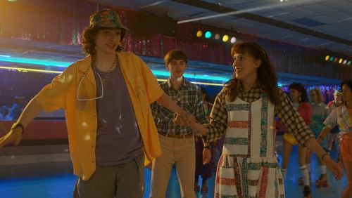 (L to R) Finn Wolfhard as Mike Wheeler, Noah Schnapp as Will Byers and Millie Bobby Brown as Eleven in STRANGER THINGS. Cr. Courtesy of Netflix © 2022