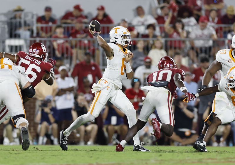 Tennessee quarterback Nico Iamaleava (8) passes the ball against Oklahoma during the second half of an NCAA college football game Saturday, Sept. 21, 2024, in Norman, Okla. (AP Photo/Alonzo Adams)