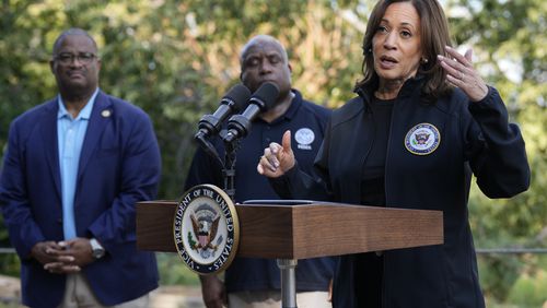 Democratic presidential nominee Vice President Kamala Harris speaks as she tours an area impacted by Hurricane Helene in Augusta, Ga., Wednesday, Oct. 2, 2024, as Augusta Mayor Garnett Johnson, left, and FEMA deputy director Erik Hooks listen. (AP Photo/Carolyn Kaster)