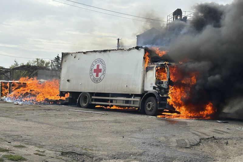 Image released by the Police of the Donetsk Region that shows a burning Red Cross vehicle that was destroyed in a Russian strike in the Donetsk region on Thursday Sept. 12, 2024. (Police of the Donetsk Region via AP)