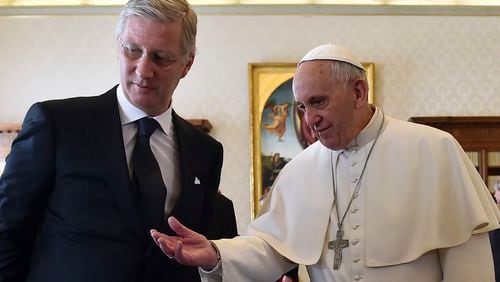 FILE -- Pope Francis, right, talks with Belgium's King Philippe during a private audience at the Vatican, Monday, March 9, 2015. (AP Photo/Gabriel Bouys, Pool, File)