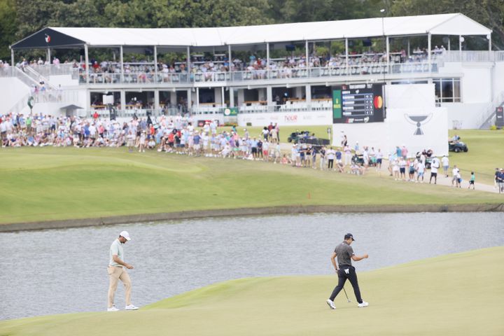 Collin Morikawa, right, reacts after putting on the eighth hole during the final round of the Tour Championship at East Lake Golf Club, Sunday, Sept. 1, 2024, in Atlanta.
(Miguel Martinez / AJC)