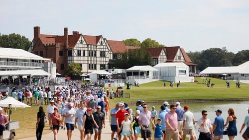 Fans walk down the driving range during the second round of the Tour Championship at East Lake Golf Club on Sunday, Sep 1, 2024, in Atlanta. 
(Miguel Martinez / AJC)