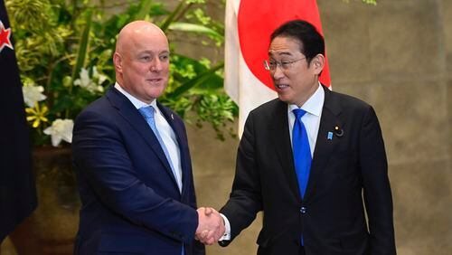 New Zealand Prime Minister Christopher Luxon, left, and Japan Prime Minister Fumio Kishida shake hands prior to their bilateral meeting at Kishida's office in Tokyo Wednesday, June 19, 2024. (David Mareuil/Pool Photo via AP)