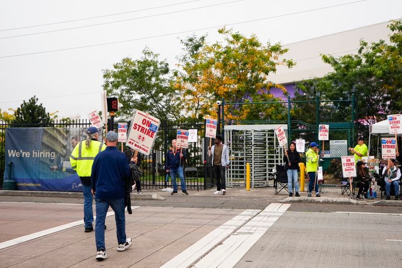 Boeing workers arrive to work the picket line as they strike Tuesday, Sept. 24, 2024, outside the company's factory in Renton, Wash. (AP Photo/Lindsey Wasson)