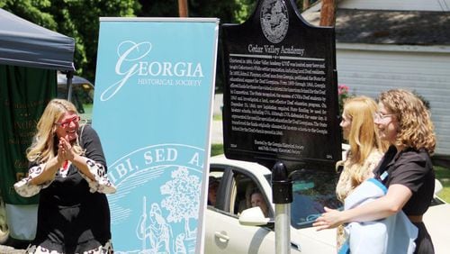 Retired educator Adonia K. Smith (from left), Polk County Historical Society Director Arleigh Johnson and Georgia Historical Society’s Breana James unveil the new historical marker for Cedar Valley Academy during a ceremony on Brooks Street in Cedartown, Georgia. (Photo Courtesy of Jeremy Stewart)