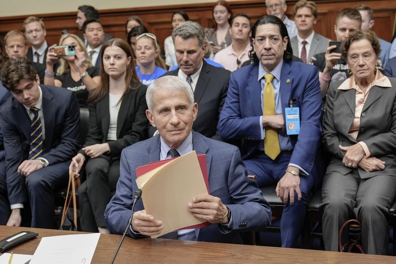 Dr. Anthony Fauci, former Director of the National Institute of Allergy and Infectious Diseases, center, arrives for a House Select Subcommittee on the Coronavirus pandemic at Capitol Hill, Monday, June 3, 2024, in Washington. (AP Photo/Mariam Zuhaib)