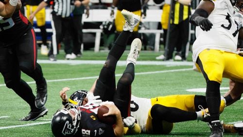 Atlanta Falcons quarterback Kirk Cousins (18) lays on the ground after being sacked in the last play of the game on Sunday, Sept. 8, at Mercedes-Benz Stadium in Atlanta. The Falcons lost 18-10.
(Miguel Martinez/ AJC)