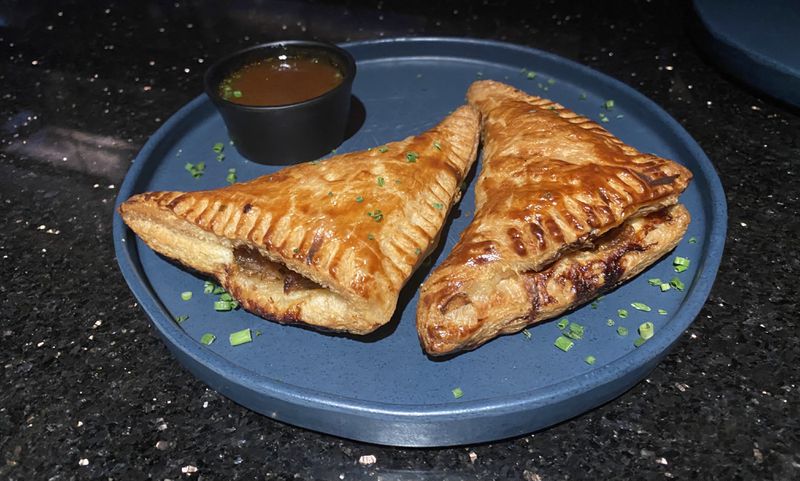The French onion hand pies at Humble Pie pack all the flavor of French onion soup into a savory pastry. Ligaya Figueras/ligaya.figueras@ajc.com  