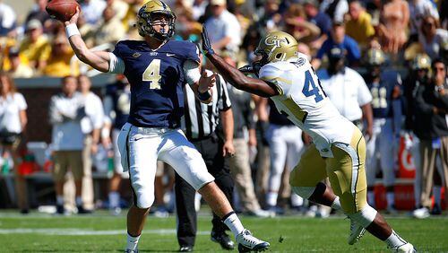ATLANTA, GA - OCTOBER 17: Nathan Peterman #4 of the Pittsburgh Panthers is pressured by KeShun Freeman #42 of the Georgia Tech Yellow Jackets at Bobby Dodd Stadium on October 17, 2015 in Atlanta, Georgia. (Photo by Kevin C. Cox/Getty Images)