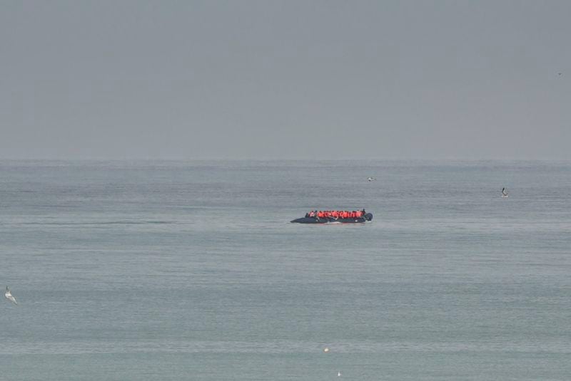 A boat thought to be with migrants is seen in the sea near the Wimereux beach, France, Wednesday, Sept. 4, 2024. A boat carrying migrants ripped apart in the English Channel as they attempted to reach Britain from northern France on Tuesday, plunging dozens into the treacherous waterway and leaving 12 dead, authorities said. (AP Photo/Nicolas Garriga)