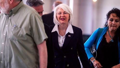 Former Mesa County, Colo., county clerk Tina Peters, center, arrives at the Mesa County Justice Center for her trial Monday, Aug. 12, 2024, in Grand Junction, Colo. (Larry Robinson/Grand Junction Sentinel via AP)