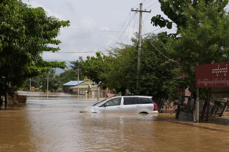 A car is submerged on a flooded road in Naypyitaw, Myanmar, Saturday, Sept. 14, 2024. (AP Photo/Aung Shine Oo)