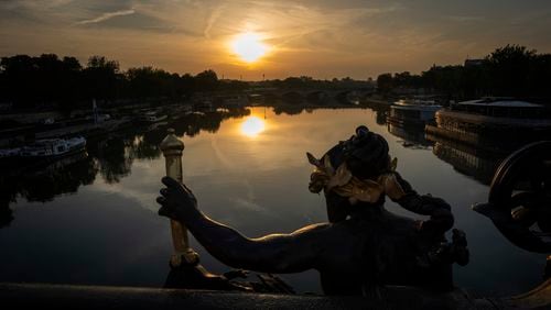 View of the Seine river where the triathlon competition has been cancelled, during the 2024 Paralympics, Sunday, Sept. 1, 2024, in Paris, France. (AP Photo/Emilio Morenatti)