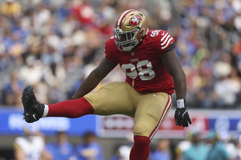 San Francisco 49ers defensive tackle Javon Hargrave (98) celebrates after sacking Los Angeles Rams quarterback Matthew Stafford during the first half of an NFL football game, Sunday, Sept. 22, 2024, in Inglewood, Calif. (AP Photo/Ryan Sun)