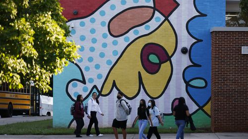 Students walk around the Cross Keys High School campus in 2022. The school's mascot is changing from "the Indians" to the Phoenix. (Miguel Martinez / AJC )