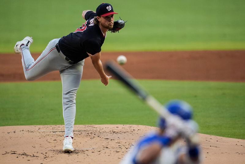 Washington Nationals pitcher Jake Irvin (27) delivers to Atlanta Braves' Ramón Laureano in the first inning of a baseball game, Saturday, Aug. 24, 2024, in Atlanta. (AP Photo/Mike Stewart)