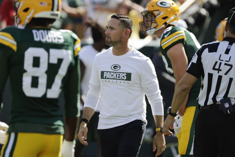 Green Bay Packers head coach Matt LaFleur watches as his team warms up ahead of an NFL football game against the Indianapolis Colts Sunday, Sept. 15, 2024, in Green Bay, Wis. (AP Photo/Mike Roemer)