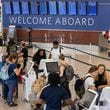 Travelers line up to check in to Delta flights at Hartsfield-Jackson International Airport in Atlanta on July 8, 2024. (Arvin Temkar/AJC)