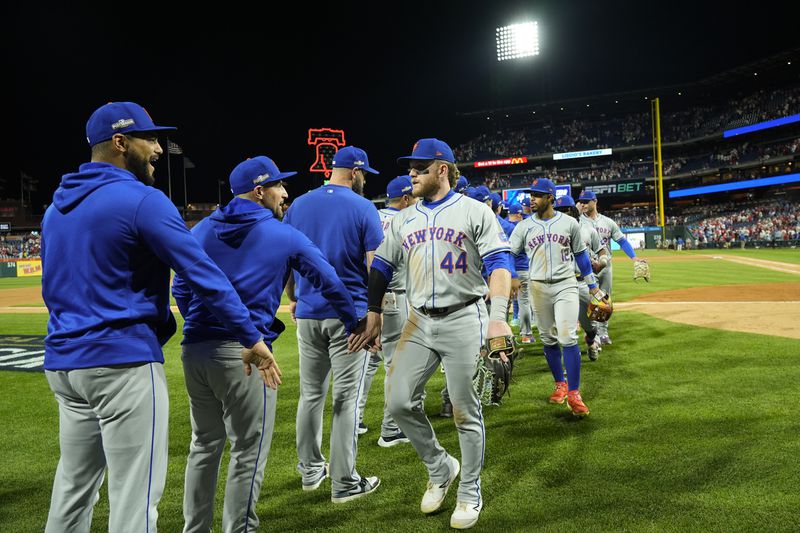 New York Mets' Harrison Bader (44) celebrates with teammates after they won Game 1 of a baseball NL Division Series against the Philadelphia Phillies, Saturday, Oct. 5, 2024, in Philadelphia. (AP Photo/Chris Szagola)