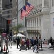 FILE - People pass the New York Stock Exchange on Oct. 1, 2024, in New York. (AP Photo/Peter Morgan, File)