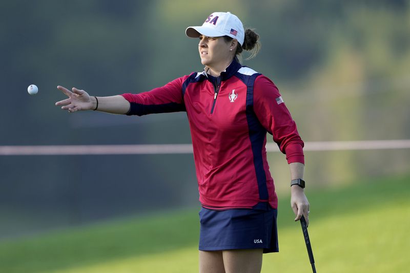 United States' Ally Ewing tosses her ball to her caddie on the first green during a practice round prior to the Solheim Cup golf tournament at the Robert Trent Jones Golf Club, Wednesday, Sept. 11, 2024, in Gainesville, VA. (AP Photo/Matt York)