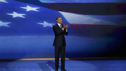 FILE - President Barack Obama stands on stage after addressing the Democratic National Convention in Charlotte, N.C., Sept. 6, 2012. (AP Photo/J. Scott Applewhite, File)