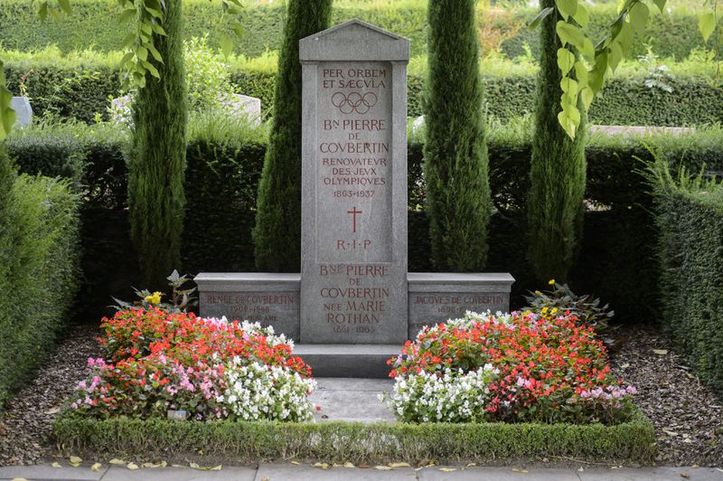 FILE - The grave of International Olympic Committee (IOC) founder baron Pierre de Coubertin is photographed at the Bois-de-Vaux cemetery, in Lausanne, Switzerland, Thursday, Sept.11, 2014. Coubertin envisioned the Olympics as a pacifist exercise that could foster international cooperation and peace, especially in the wake of France's defeat in the Franco-Prussian War. (AP Photo/Keystone,Laurent Gillieron, File)