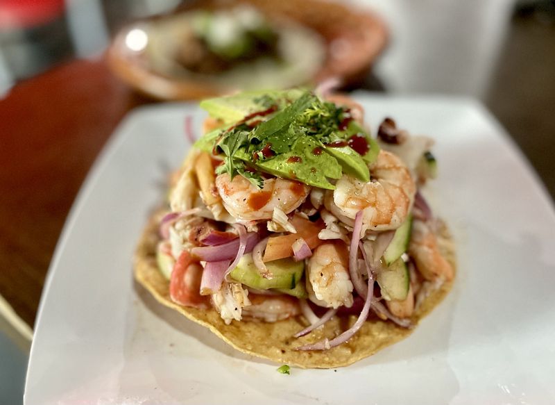 Sonoran-style tostada de ceviche mixto from La Costilla Grill on Buford Highway. (Angela Hansberger for The Atlanta Journal-Constitution)